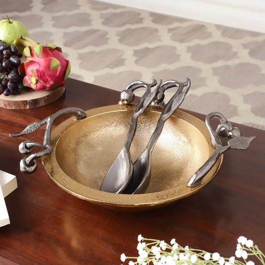 Golden decorative bowl with serving spoon