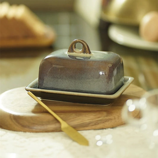 Butter Dish and a Brass knife spreader