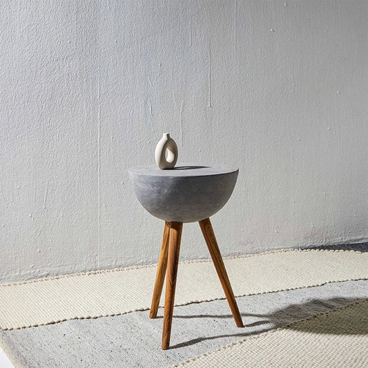 Table with concrete top and wooden legs