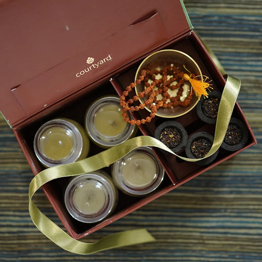 Glass candle, sambarni dhoop and rudraksha mala