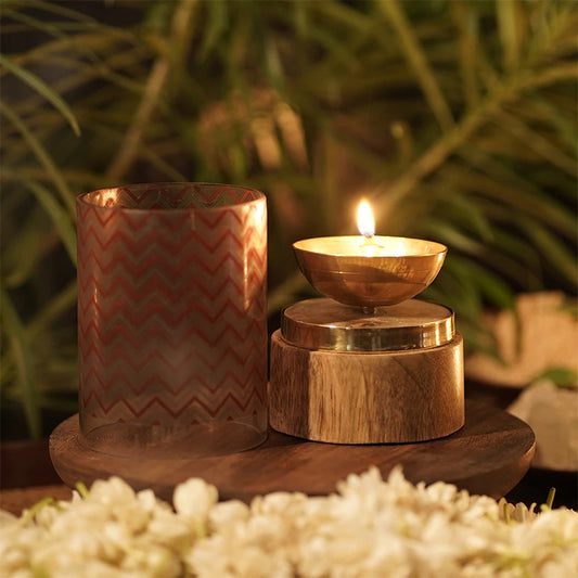 Brass diya with wooden base and glass cover