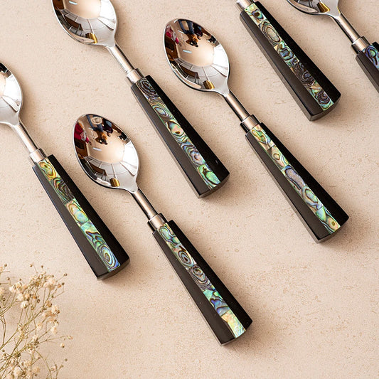 Stainless steel spoon with abalone shell grip