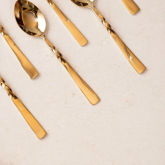 Stainless steel spoon with gold finish
