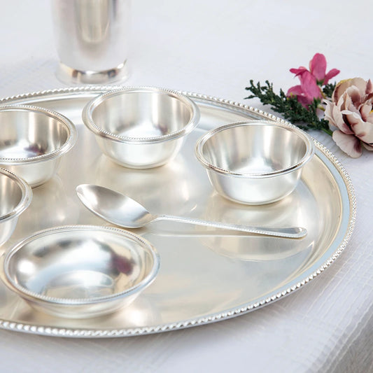 Set of silver spoon, silver bowl, and silver glass