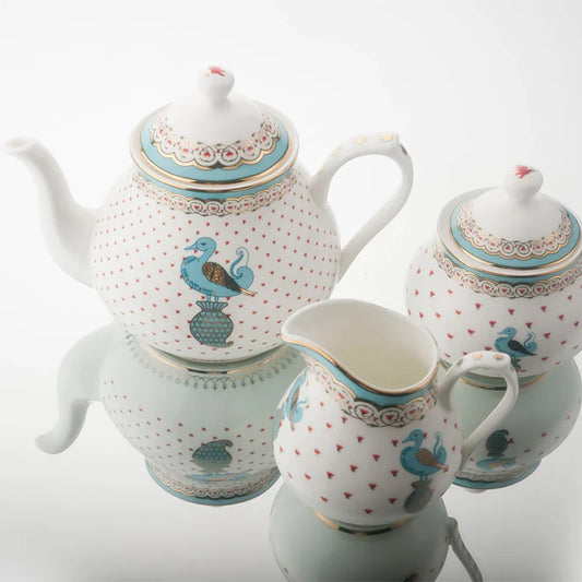 Ceramic sugar pot, creamer, and tea pot 