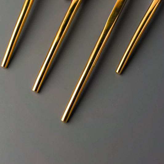 Cutlery set with sleek gold coated handle
