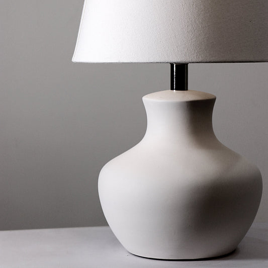 Lamp with ceramic base and fabric shade