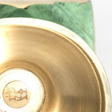 Close up of a Zebrowski brass vase
