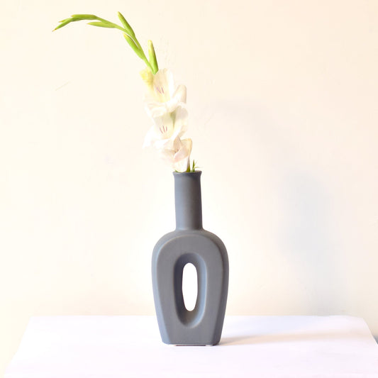 flower-filled grey ceramic vase
