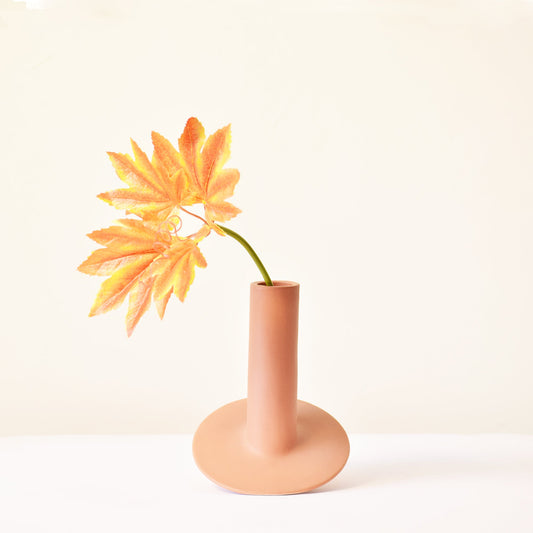 Ceramic flower vase in withered rose