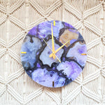 Unique wall clock in purple stone