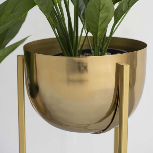 Close up of swing gold planter stand