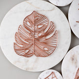 rose gold metal and white marble disk wall art