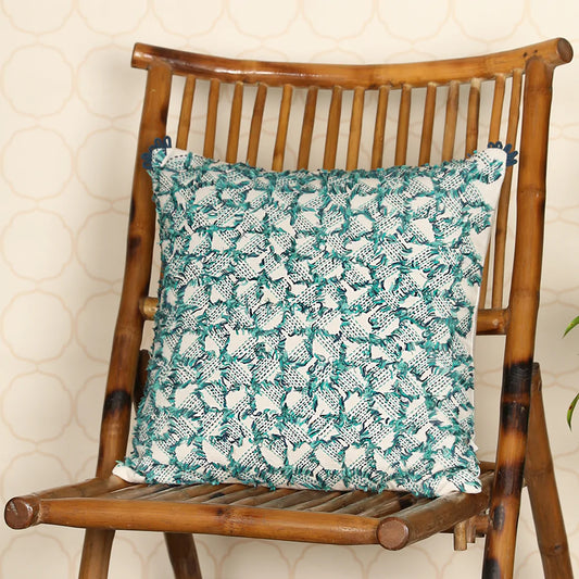 Blue and white color cushion cover on wooden chair