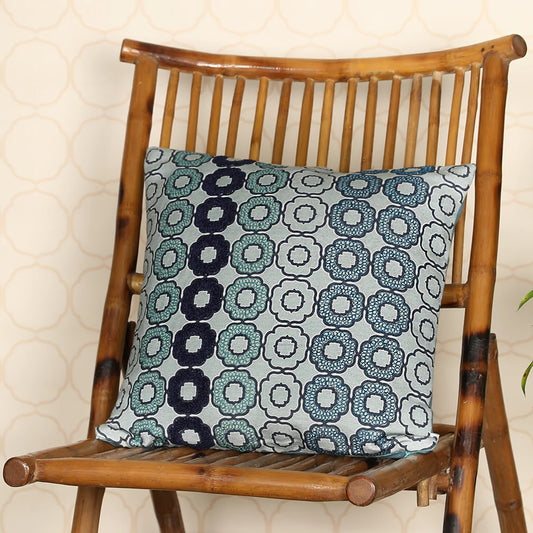 Soft blue cushion on wooden chair