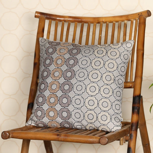 Fossil throw pillow on wooden chair