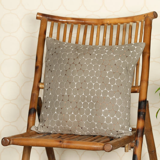 Light grey cushion on wooden chair