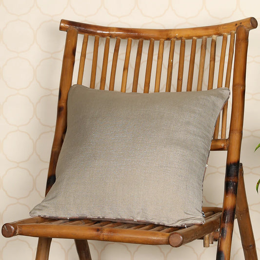 Pewter cushion on wooden chair