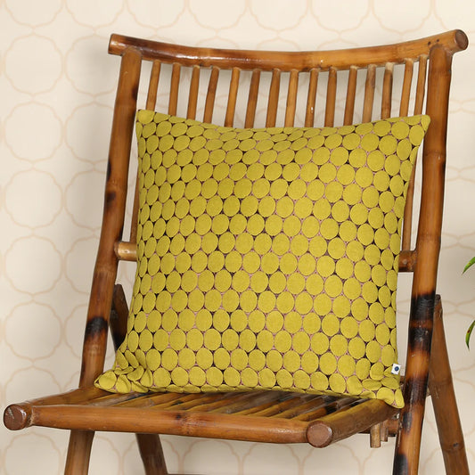 Yellow cushion cover on wooden chair