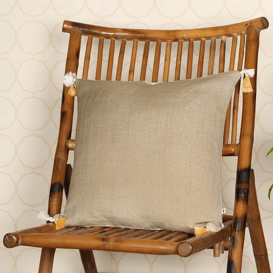 Tan cushion on wooden chair