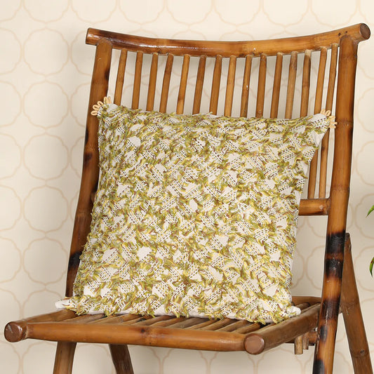 Yellow cushion on wooden chair