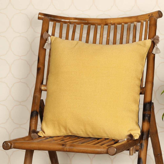Throw pillow on wooden chair in yellow color