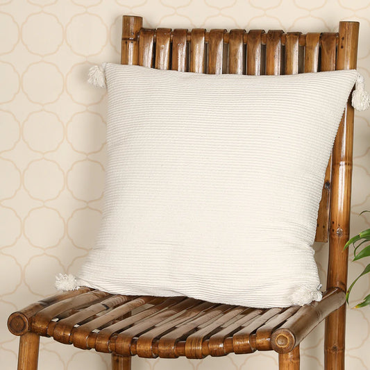 White cushion on wooden chair