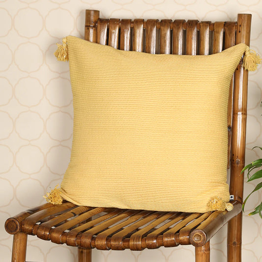 Yellow cushion cover on wooden chair
