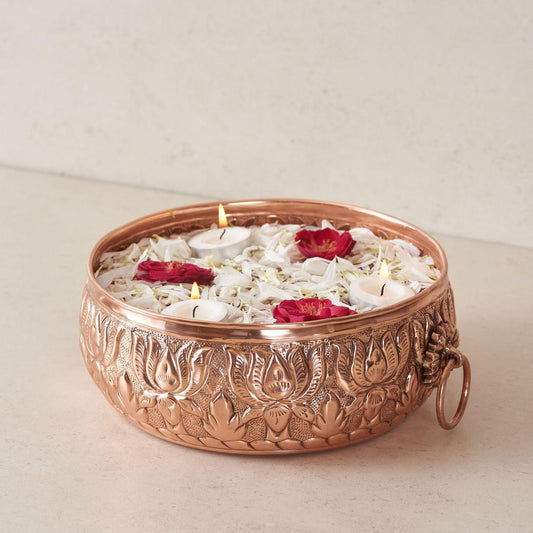 Copper urli bowl with flower decoration  