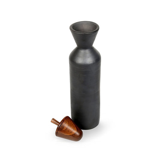 black bottle with wooden spin top