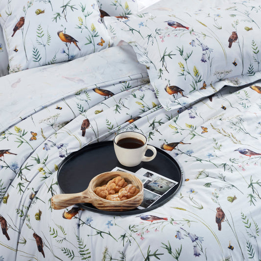 Round tray with snacks on bed 