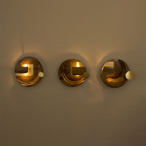 three brown wooden wall sconces