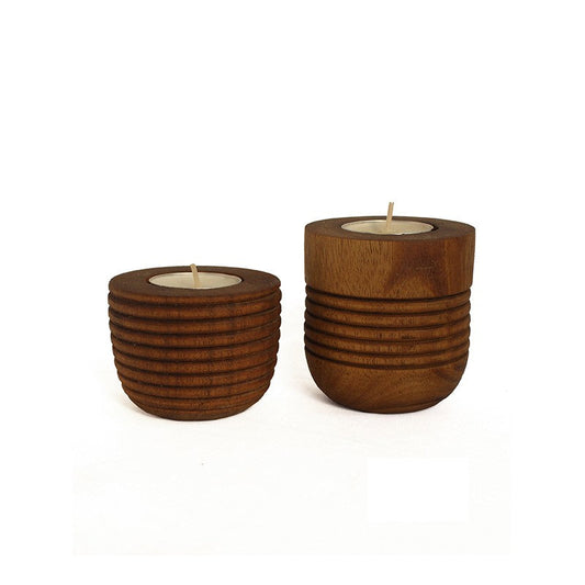 two different sized wooden tea lights