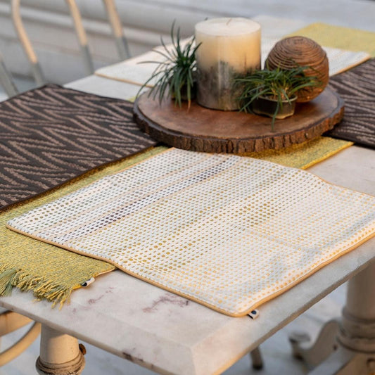 Handwoven table mat in dotted design