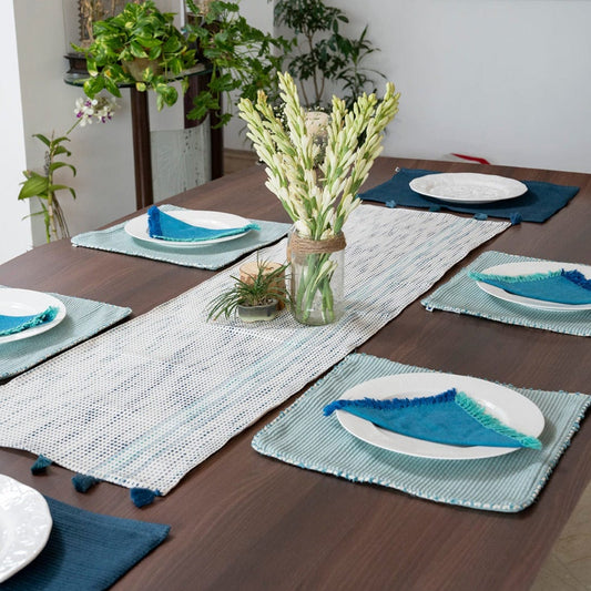 Sky color table mats, blue table napkins and white plate