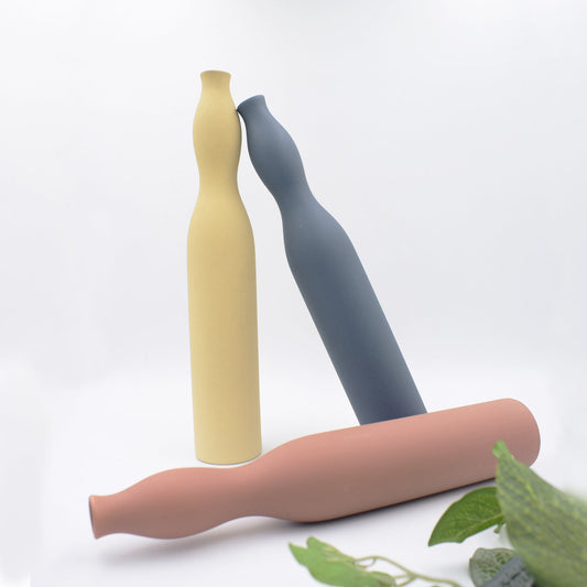Three flute vases in different colours