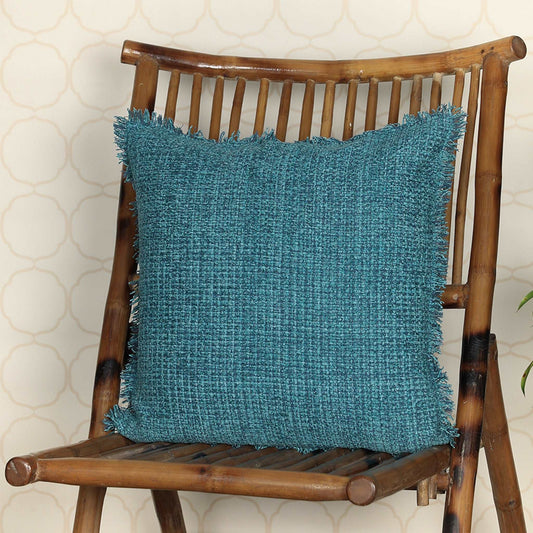 Blue cushion on wooden chair with flakes