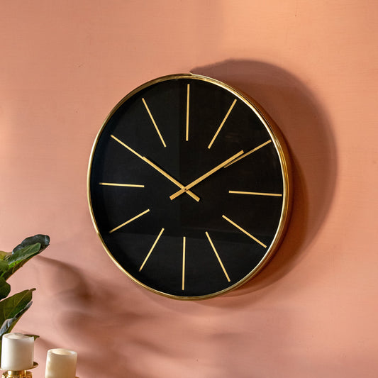 Black wall clock with golden rim