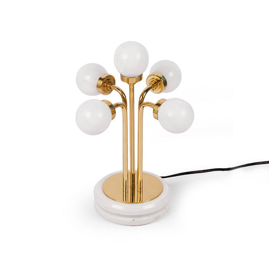Table lamp standing on a marble base with brass pipes