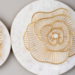Close up of white and gold wall plate