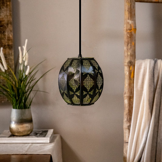 black and gold pendant light dangling in a room