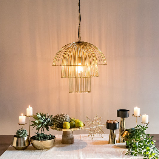 Lighted gold hanging light over the table