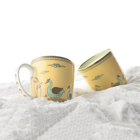 two coffee mugs in yellow color