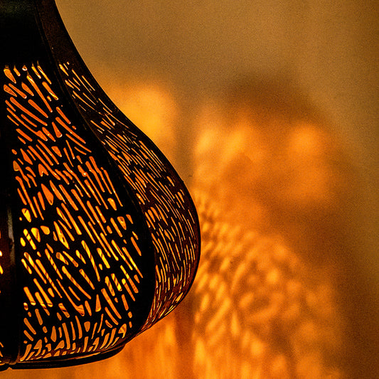 close up of a black latticework hanging lamp