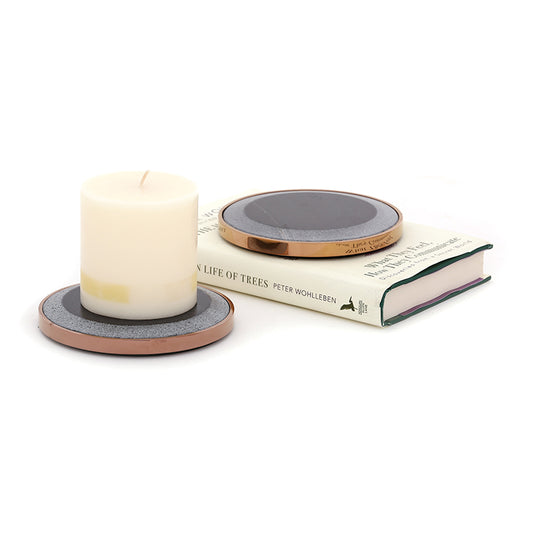 two black candle plates in marble