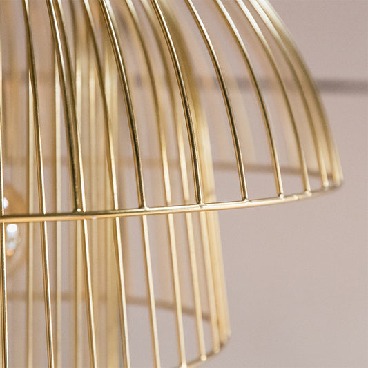 close up of a wired structure gold pendant light