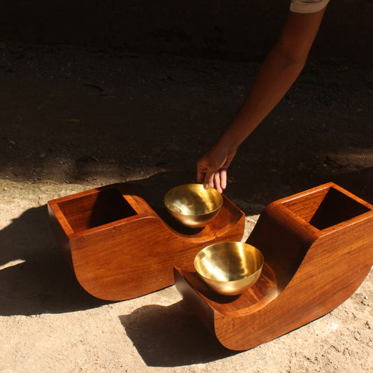 two wooden planters with brass bowls