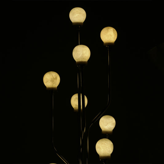 floor lamp with many moon-like lighted bulbs
