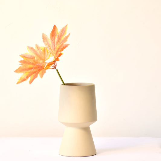 Pedestal off white vase with flower