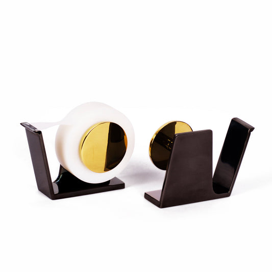 Tape dispenser in gold and black finish